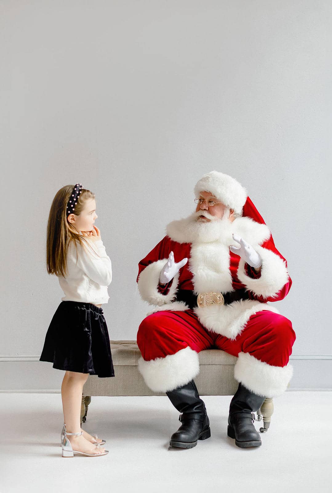Santa and girl in photo studio