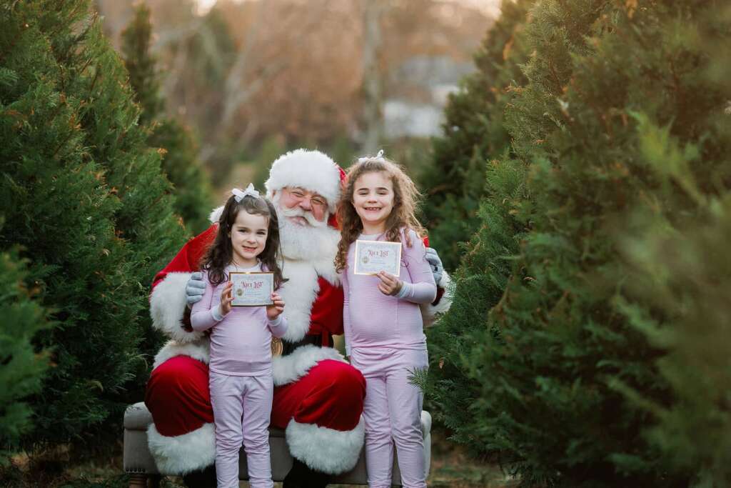 Santa and kids in tree farm